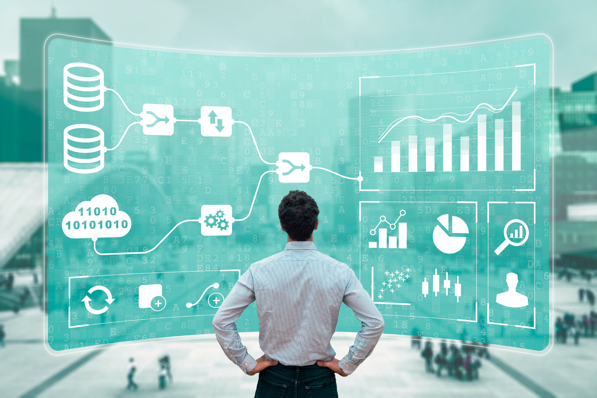 Data Analyst standing in front of a big screen which explains the process of data analysis.